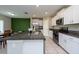 Modern kitchen with granite countertops and stainless steel appliances at 10348 Blue Plume Ct, Riverview, FL 33578