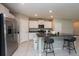 Modern kitchen with stainless steel appliances and an island at 10348 Blue Plume Ct, Riverview, FL 33578