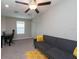 Loft with ceiling fan, comfortable couch, and desk at 10348 Blue Plume Ct, Riverview, FL 33578