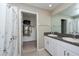 Bathroom boasts double sinks and walk-in shower at 10348 Blue Plume Ct, Riverview, FL 33578
