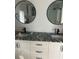 Bathroom vanity with granite countertop, showing water damage at 1875 Michigan Ne Ave, St Petersburg, FL 33703