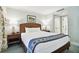 Well-lit bedroom with a queen-size bed and nightstands at 36750 Us Highway 19 # 21212, Palm Harbor, FL 34684