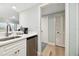 Modern kitchen features white cabinets, stainless steel appliances, and quartz countertops at 36750 Us Highway 19 # 21212, Palm Harbor, FL 34684