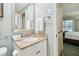 Clean bathroom with single sink vanity and view into bedroom at 36750 Us Highway 19 # 21212, Palm Harbor, FL 34684