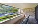 View from balcony overlooking the parking lot and trees at 36750 Us Highway 19 # 21212, Palm Harbor, FL 34684