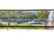 Overlooks community parking lot and lush landscaping at 36750 Us Highway 19 # 21212, Palm Harbor, FL 34684