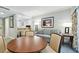 Bright living room with seating area and a view to the patio at 36750 Us Highway 19 # 21212, Palm Harbor, FL 34684