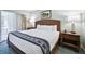 King-size bed, nightstands, and stylish decor in this bedroom at 36750 Us Highway 19 # 21212, Palm Harbor, FL 34684