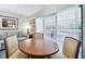 Round dining table with four chairs, near a patio at 36750 Us Highway 19 # 21212, Palm Harbor, FL 34684