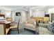 Open living space with seating area, dining table, and a view into the kitchen at 36750 Us Highway 19 # 21212, Palm Harbor, FL 34684