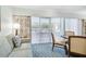 Comfortable living room with sofa, chairs, and a view of the patio at 36750 Us Highway 19 # 21212, Palm Harbor, FL 34684
