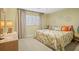 Bright bedroom with king-size bed and tropical bedding at 1200 N Shore Ne Dr # 414, St Petersburg, FL 33701