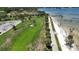 Beachfront walkway with lush green space and palm trees at 1200 N Shore Ne Dr # 414, St Petersburg, FL 33701