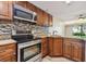 Updated kitchen with stainless steel appliances and granite countertops at 36750 Us Highway 19 N # 19106, Palm Harbor, FL 34684