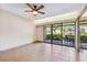 Bright living room with tile floors and sliding doors leading to a patio at 36750 Us Highway 19 N # 19106, Palm Harbor, FL 34684