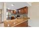 Granite countertop kitchen with stainless steel appliances at 36750 Us Highway 19 N # 19106, Palm Harbor, FL 34684