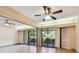 Living area with tile floors and access to patio at 36750 Us Highway 19 N # 19106, Palm Harbor, FL 34684