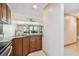 Modern kitchen with granite countertops and wood cabinets at 36750 Us Highway 19 N # 19106, Palm Harbor, FL 34684
