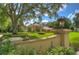 Elegant home entrance with landscaped drive at 7734 Still Lakes Dr, Odessa, FL 33556