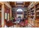Bright home office with custom built-ins and hardwood floors at 7734 Still Lakes Dr, Odessa, FL 33556