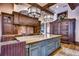 Elegant kitchen featuring granite countertops and wood cabinetry at 7734 Still Lakes Dr, Odessa, FL 33556