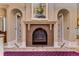 Elegant Primary bathroom features a fireplace and two doorways at 7734 Still Lakes Dr, Odessa, FL 33556