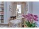 Cozy sitting room with a comfy chair, ottoman and built-in shelving at 7734 Still Lakes Dr, Odessa, FL 33556