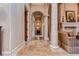 Elegant hallway with arched doorways and tile flooring at 7734 Still Lakes Dr, Odessa, FL 33556
