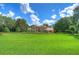 Two-story house with manicured lawn, and landscaping at 7734 Still Lakes Dr, Odessa, FL 33556