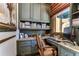 Home office with built-in bookshelves and granite desk at 7734 Still Lakes Dr, Odessa, FL 33556