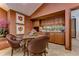 Convenient wet bar with wood cabinetry and granite countertops at 7734 Still Lakes Dr, Odessa, FL 33556