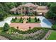 Grand home exterior with landscaped grounds at 7734 Still Lakes Dr, Odessa, FL 33556