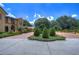 Brick driveway with lush landscaping leading to a grand home at 7734 Still Lakes Dr, Odessa, FL 33556