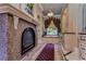 Luxurious bathroom with soaking tub, fireplace, and marble finishes at 7734 Still Lakes Dr, Odessa, FL 33556