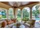 Relaxing patio features comfortable seating and tranquil views at 7734 Still Lakes Dr, Odessa, FL 33556