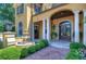 Ornate front entry with decorative fountain and lush landscaping at 7734 Still Lakes Dr, Odessa, FL 33556