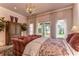 Serene bedroom with water views and luxurious bedding at 7734 Still Lakes Dr, Odessa, FL 33556