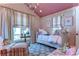 Charming bedroom with twin beds, window seating, and colorful decor at 7734 Still Lakes Dr, Odessa, FL 33556