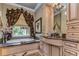 Spa-like bathroom with soaking tub, dual vanities, and large windows at 7734 Still Lakes Dr, Odessa, FL 33556