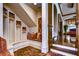Mudroom with built-in bench, cubbies, and hardwood floors at 7734 Still Lakes Dr, Odessa, FL 33556