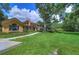 Landscaped backyard with lush greenery, providing a tranquil outdoor space at 7734 Still Lakes Dr, Odessa, FL 33556
