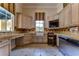 Laundry room with built-in cabinets and workspace at 7734 Still Lakes Dr, Odessa, FL 33556