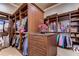 Large walk-in Primary closet with ample shelving and hanging space at 7734 Still Lakes Dr, Odessa, FL 33556