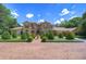 Luxury two-story house with manicured landscaping and brick driveway at 7734 Still Lakes Dr, Odessa, FL 33556