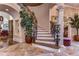 Elegant curved staircase with wrought iron railing at 7734 Still Lakes Dr, Odessa, FL 33556