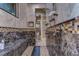 Large walk-in shower with marble finishes and multiple shower heads at 7734 Still Lakes Dr, Odessa, FL 33556