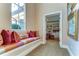 Built in bench with colorful pillows in a hallway at 7734 Still Lakes Dr, Odessa, FL 33556