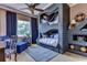 Nautical-themed bedroom with custom bunk beds and built-in shelving at 7734 Still Lakes Dr, Odessa, FL 33556