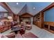 Relaxing game room featuring comfortable seating, a large screen, and built-in shelving at 7734 Still Lakes Dr, Odessa, FL 33556