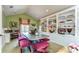 Bright home office with built in shelving and a work desk at 7734 Still Lakes Dr, Odessa, FL 33556